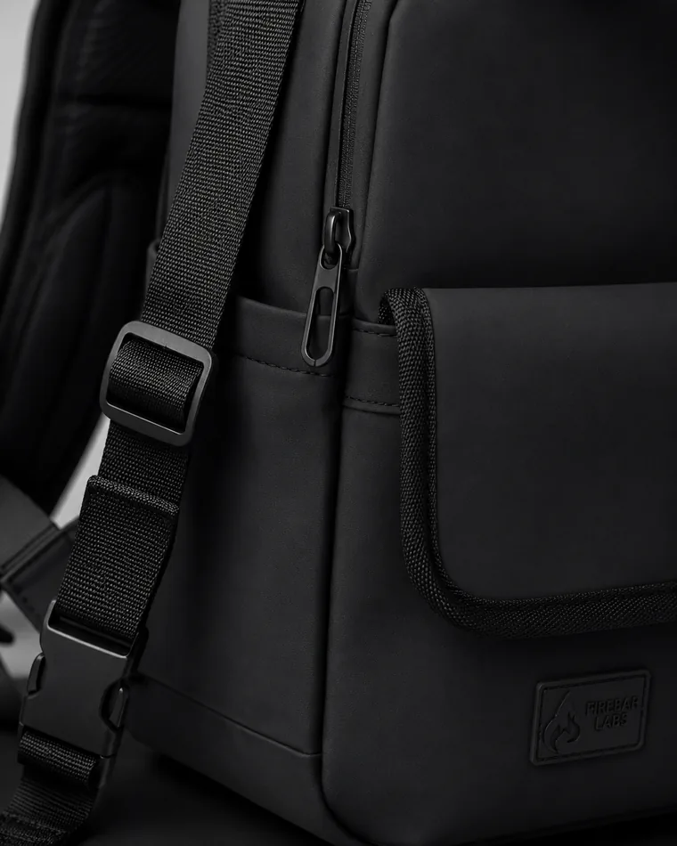 Close detail on the matte finish and stitching of a black Executive Tech backpack.