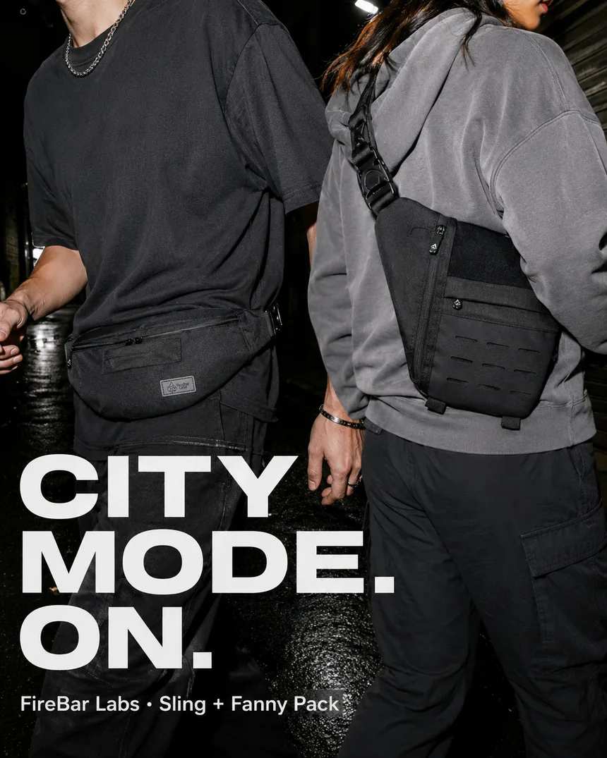 A person carrying an Executive Tech crossbody through a city street at dusk.