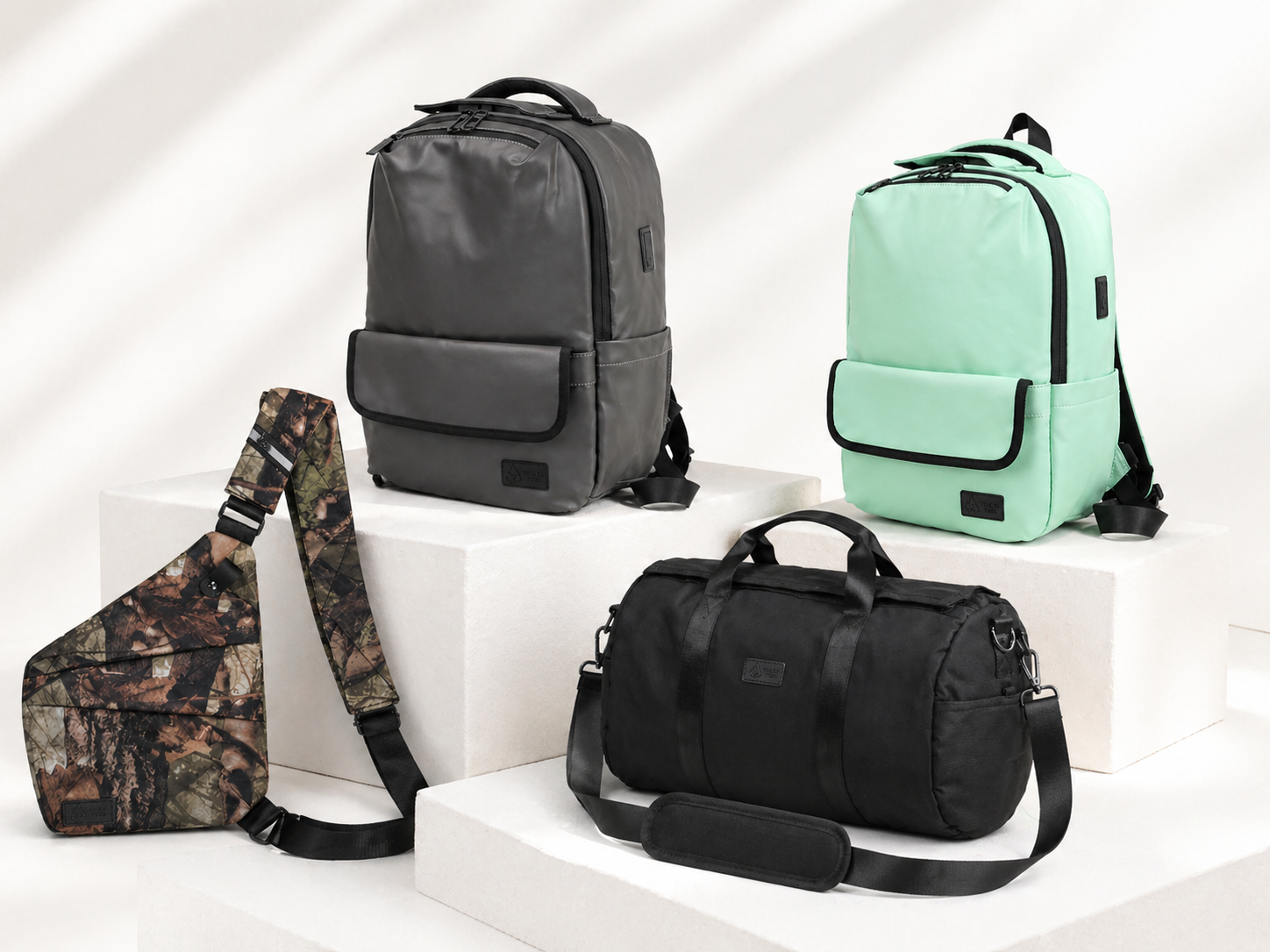 Essential bag bundle on pedestal — full lineup